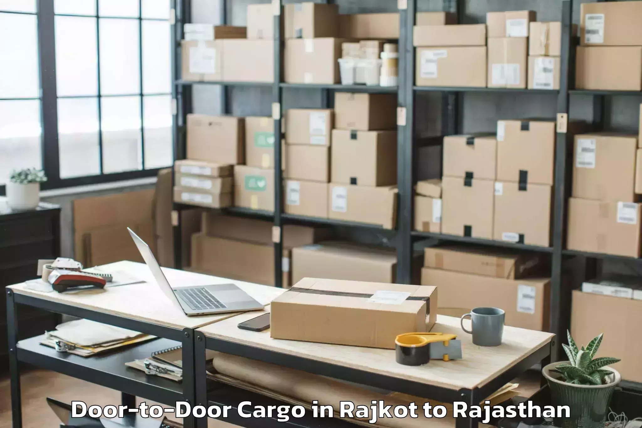 Professional Rajkot to Niit University Neemrana Door To Door Cargo